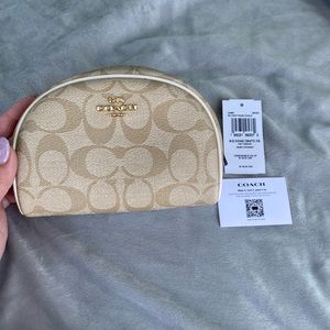 NWOT Cream/Beige Coach Makeup / cosmetic bag. Perfect condition.